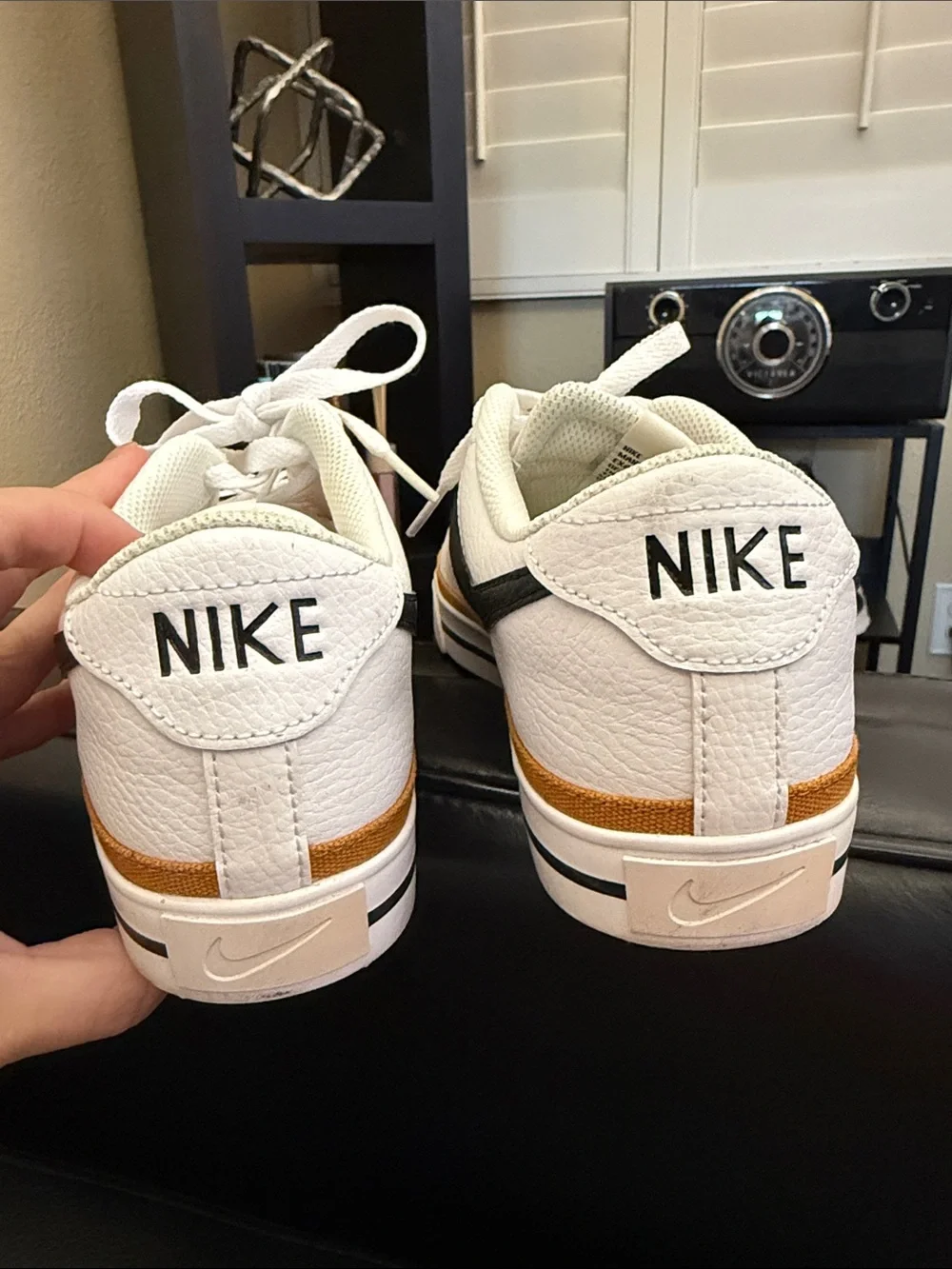 Nike White Low-Top Sneakers with Black Swoosh and Brown Trim
